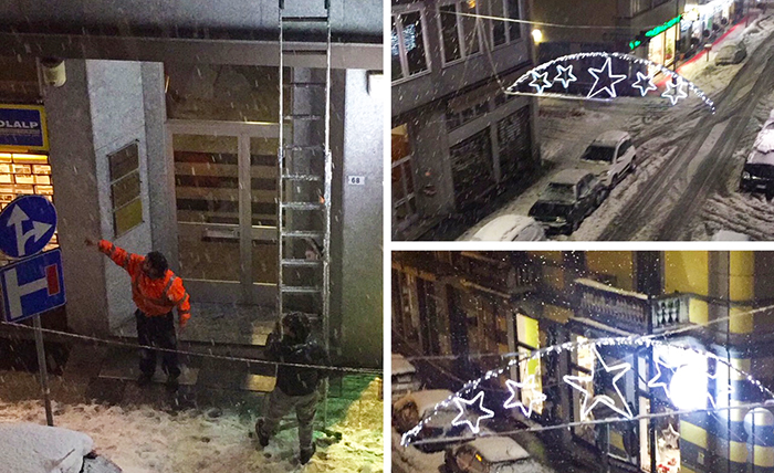 Troppa neve sulle luminarie domesi, intervento notturno degli operai